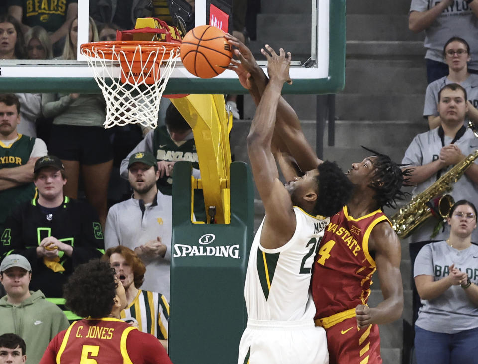 Iowa State guard Demarion Watson, right, blocks a shot by Baylor center Yves Missi, second from right, in the first half of an NCAA college basketball game, Saturday, Feb. 3, 2024, in Waco, Texas. (AP Photo/Rod Aydelotte)