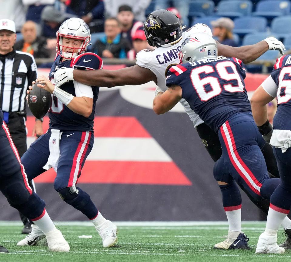 Patriots Qb Mac Jones is pressured by Ravens Defensive tackle #93 Calais Campbell in the 2nd half.New England Patriots host the Baltimore Ravens 9/25/2022.[The Providence Journal / Bob Breidenbach]