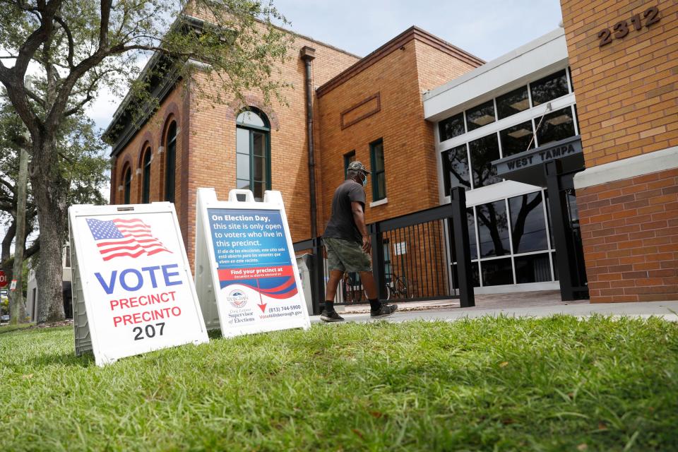 Voters enter their polling place on August 23, 2022 in Tampa, Florida.