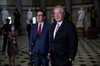 White House Chief of Staff Mark Meadows, right, accompanied by Treasury Secretary Steven Mnuchin, left, speaks to reporters after meeting with House Speaker Nancy Pelosi of Calif. and Senate Minority Leader Sen. Chuck Schumer of N.Y. as they continue to negotiate a coronavirus relief package on Capitol Hill in Washington, Friday, Aug. 7, 2020. (AP Photo/Andrew Harnik)