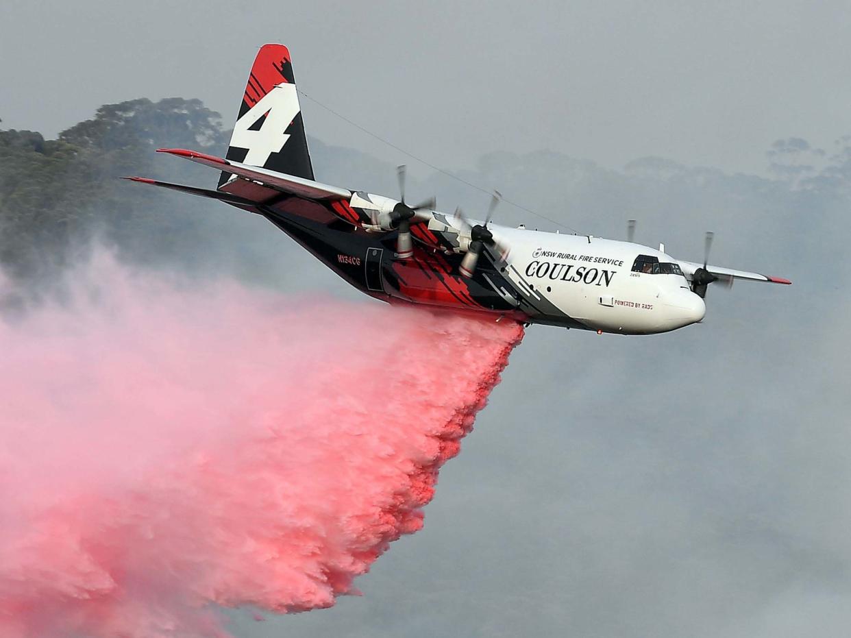 The C-130 Hercules which crashed, seen dropping fire retardant (file picture): SAEED KHAN/AFP via Getty Images