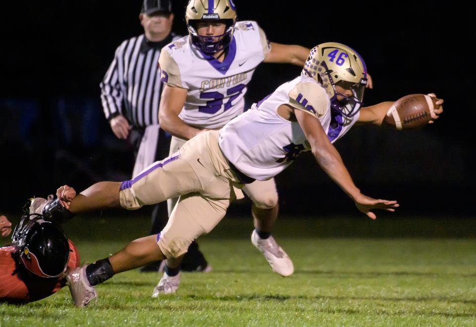 Canton's LaShawn Wallace dives for extra yardage against Metamora in the first half Friday, Sept. 23, 2022 in Metamora.