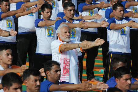 Prime Minister Narendra Modi performs yoga on International Yoga Day in Dehradun in Uttarakhand, India June 21, 2018. REUTERS/Stringer