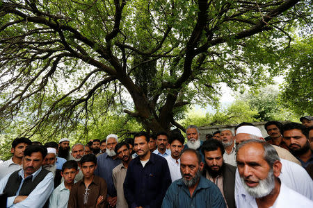 Men attend a village meeting in front of the mosque after Friday prayers to discuss the events surrounding the murder of Ambreen Riasat in the village of Makol outside Abbottabad, Pakistan May 6, 2016. REUTERS/Caren Firouz