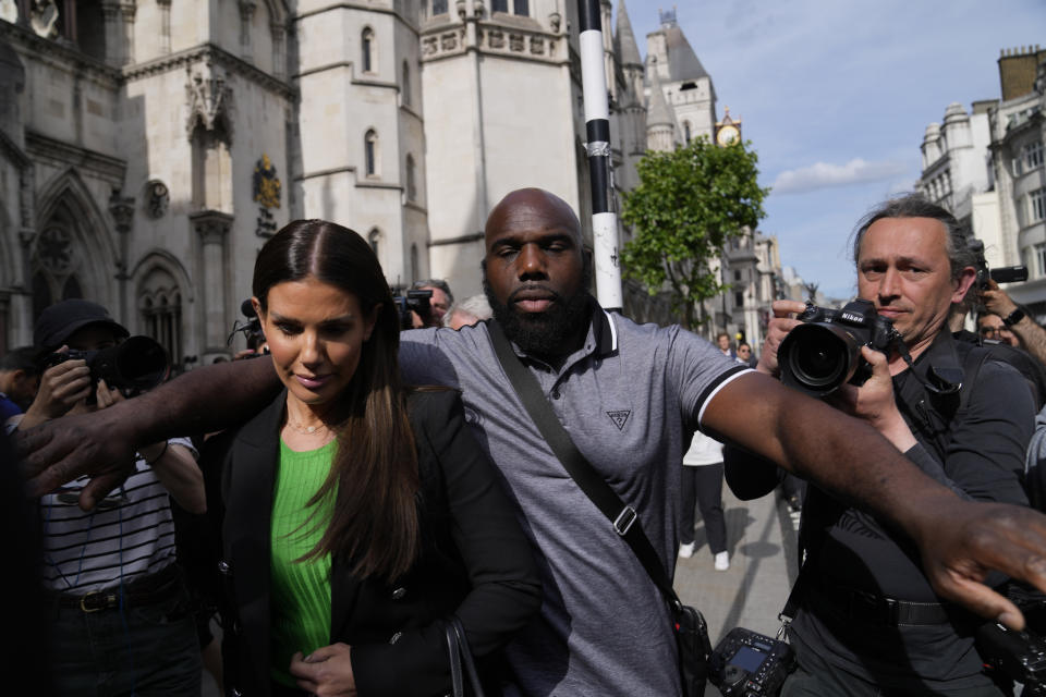 Rebekah Vardy departs the High Court in London, Thursday, May 19, 2022. A trial involving a social media dispute between two soccer spouses has opened in London. Rebekah Vardy sued for libel after Coleen Rooney accused her of sharing her private social media posts with The Sun newspaper. (AP Photo/Alastair Grant)