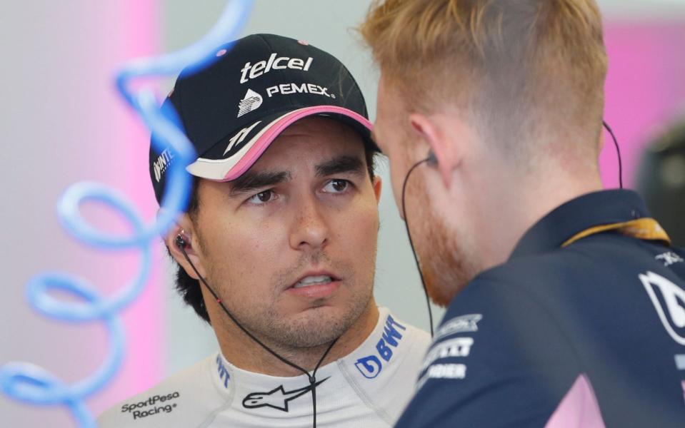 Sergio Perez chats with his mechanics - SHUTTERSTOCK