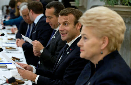 French President Emmanuel Macron and Lithuania's President Dalia Grybauskaite (R) attend a dinner in Tallinn ahead of an informal European Union leaders summit, Estonia September 28, 2017. REUTERS/Virginia Mayo/Pool