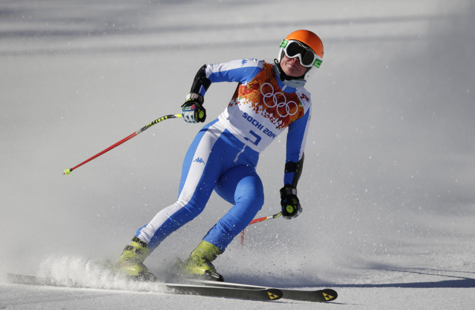 Italy's Verena Stuffer comes to a halt in the finish area after completing a women's downhill training run at the Sochi 2014 Winter Olympics, Thursday, Feb. 6, 2014, in Krasnaya Polyana, Russia. (AP Photo/Gero Breloer)