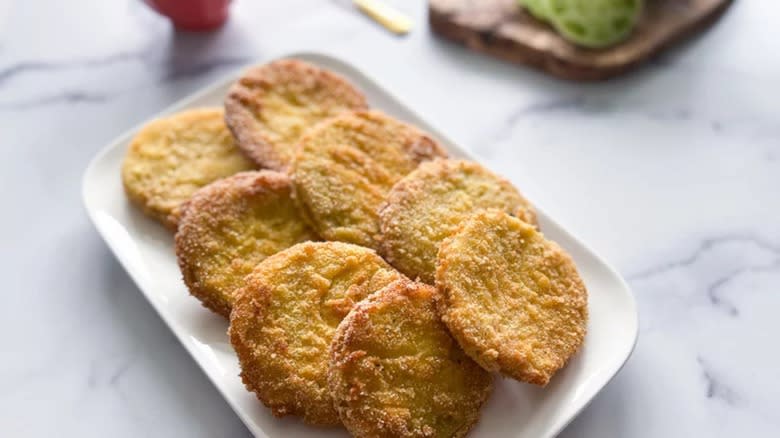 Fried green tomatoes on white platter