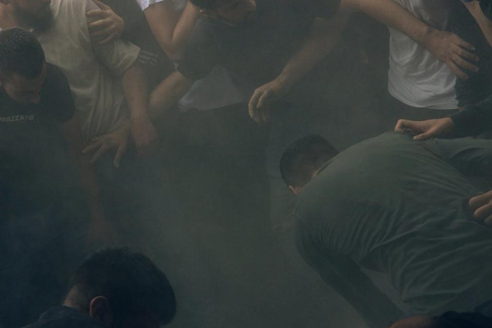 Dust settles as Yasser al-Kasba, 17, is laid to rest at Qalandia refugee camp on Oct. 9. <span class="copyright">Maen Hammad</span>