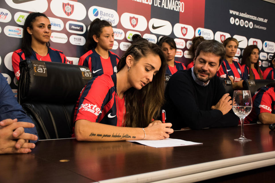 BUENOS AIRES, ARGENTINA - APRIL 12: Maca Sánchez signs her contract with San Lorenzo next to President of San Lorenzo Matías Lammens during the signing of the first professional contract in Argentina Women Football League on April 12, 2019 in Buenos Aires, Argentina. Sanchez headed women's claim for equality and professional contracts and had recently resigned from UAI Urquiza after being denied a professional contract. (Photo by Franco Fafasuli/Getty Images)