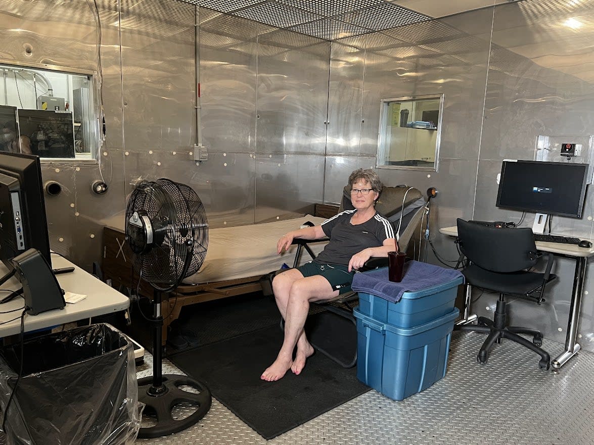 A woman participates in an ongoing study at the University of Ottawa on electric fans and their ineffectiveness in cooling ourselves during extreme heat.  (Submitted by Rob Meade - image credit)