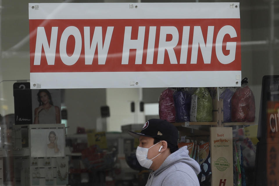 A “Now Hiring” sign at a CVS Pharmacy. - Credit: Jeff Chiu/AP