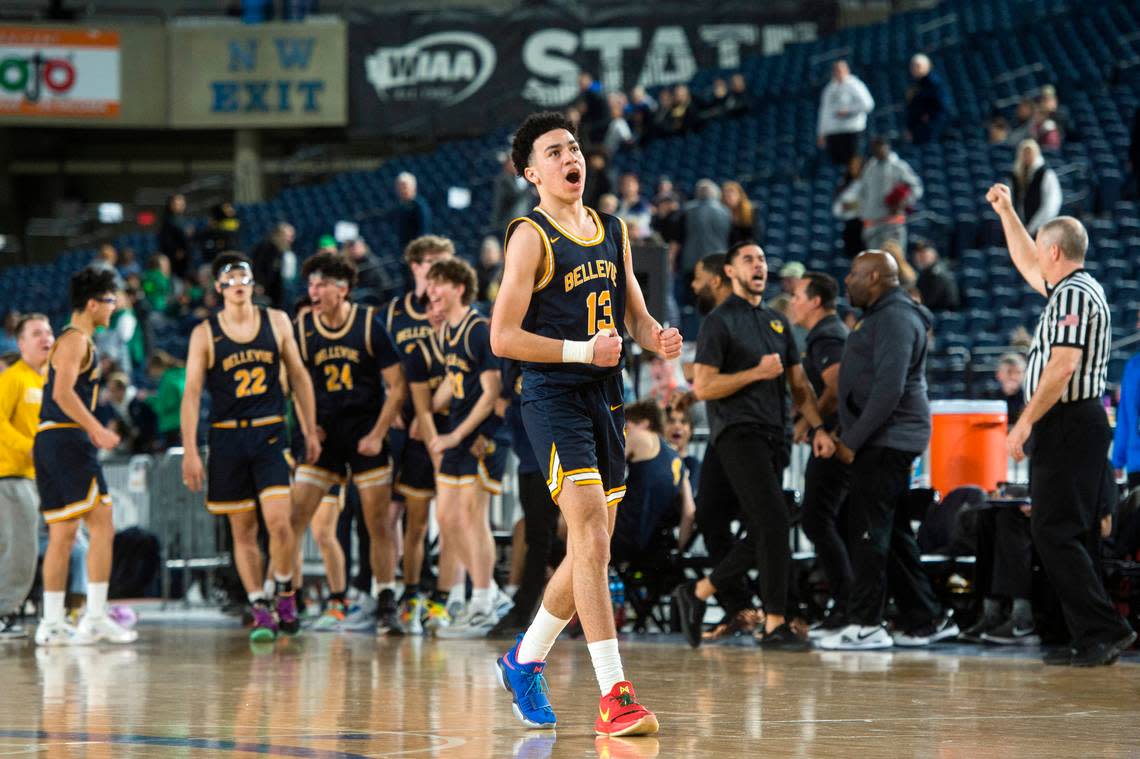Bellevue guard Bryce Smith (13) celebrates a Wolverines basket in the fourth quarter against Eastside Catholic in the fourth-sixth place game of the Class 3A boys state basketball tournament on Saturday, March 4, 2023 at the Tacoma Dome in Tacoma, Wash.
