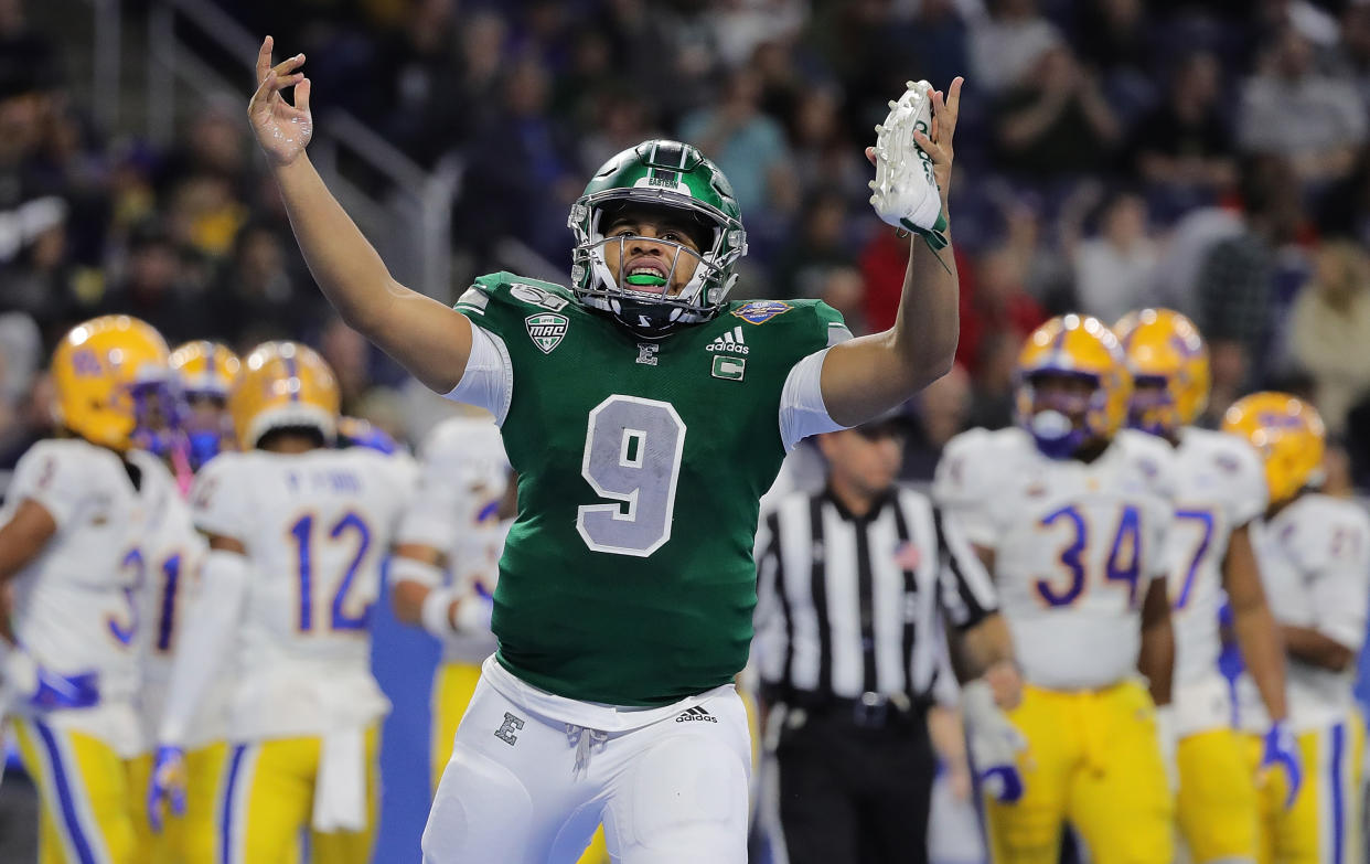 DETROIT, MI - DECEMBER 26: Mike Glass III #9 of the Eastern Michigan Eagles celebrates a touchdown during the first quarter of the game against Pittsburgh Panthers at the Quick Lane Bowl at Ford Field on December 26, 2019 in Detroit, Michigan. (Photo by Leon Halip/Getty Images)