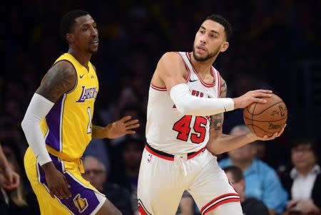 November 21, 2017; Los Angeles, CA, USA; Chicago Bulls forward Denzel Valentine (45) controls the ball against Los Angeles Lakers guard Kentavious Caldwell-Pope (1) during the second half at Staples Center. Mandatory Credit: Gary A. Vasquez-USA TODAY Sports