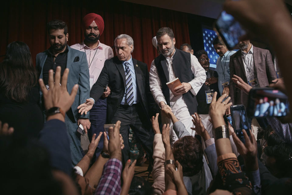 Indian politician Rahul Gandhi, center right, leaves after his speech at the Javits Center, Sunday, June 4, 2023, in New York. (AP Photo/Andres Kudacki)