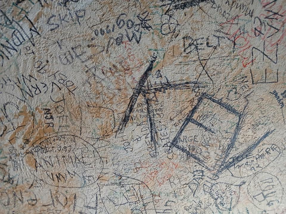 On the ceiling at the Cabbage Patch Bar, messages document wild nights or life milestones.