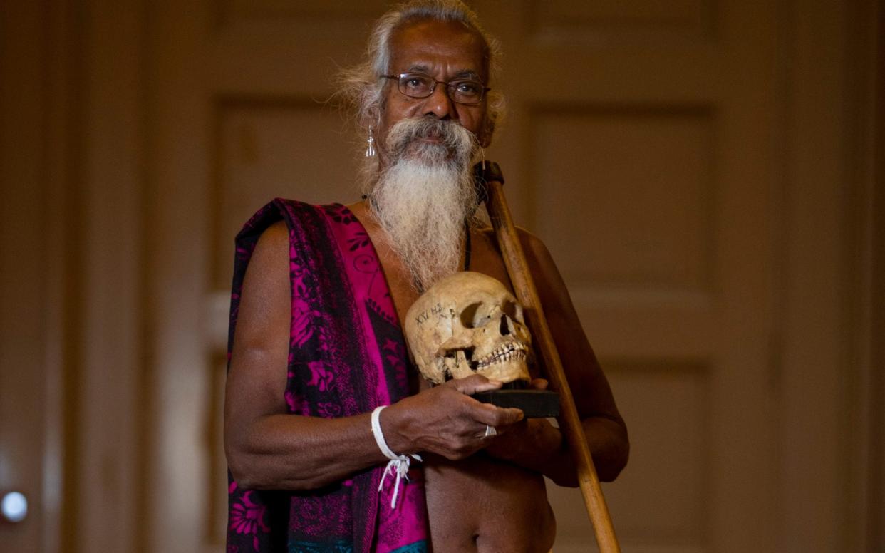 Wanniya Uruwarige, chief of the jungle-dwelling Vedda tribe, with one of the nine human skulls to be returned to their homeland of Sri Lanka after more than 100 years in Edinburgh - SWNS