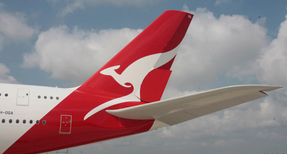 A Qantas plane in the sky. 