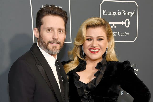 <p>Kevin Mazur/Getty</p> Brandon Blackstock and Kelly Clarkson in Santa Monica in January 2020