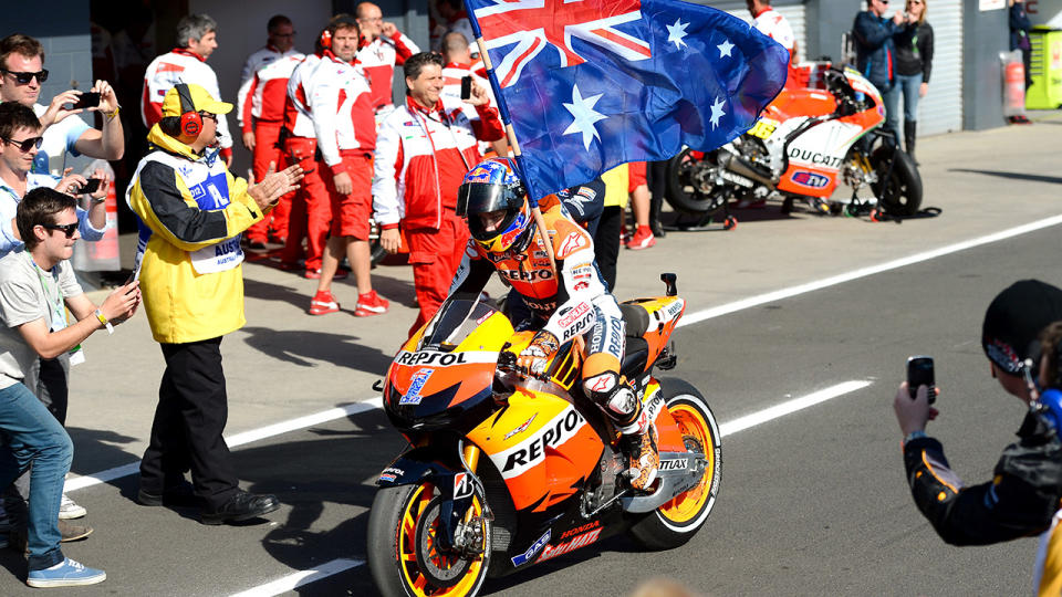 Casey Stoner is pictured after winning the Australian MotoGP race at Phillip Island in 2012. (Photo credit should read WILLIAM WEST/AFP via Getty Images)