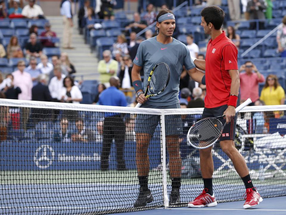 Nadal of Spain and Djokovic of Serbia greet each other before their men's final match at the U.S. Open tennis championships in New York