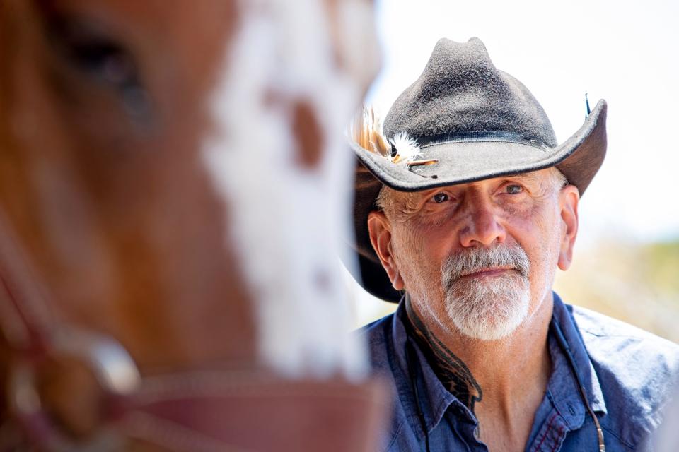 Jeff Eamer, a psychotherapist, moved from Los Angeles to Yucca Valley, where he now holds therapy sessions out in nature at Joey's Home Animal Rescue in Yucca Valley, Calif., on June 29, 2022. 