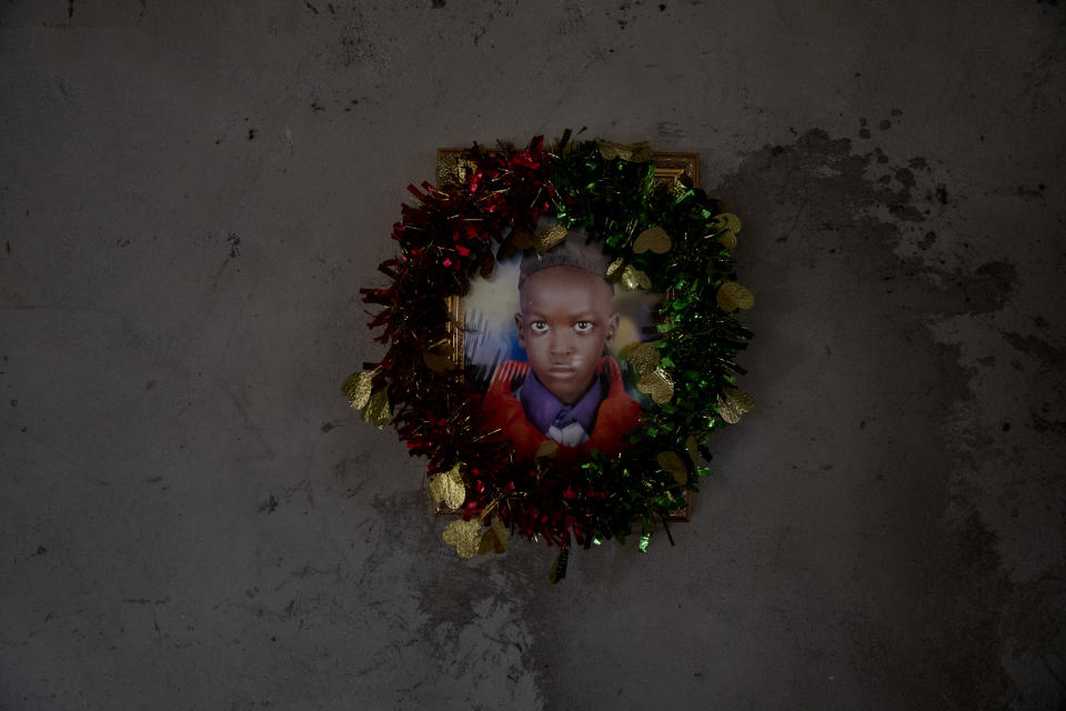 A photo of one of Paska Itwari Beda's five children hangs on the wall at her Juba, South Sudan home, Saturday, May 29, 2021. Even before the pandemic hit, South Sudanese women were accustomed to building lives on the edge of uncertainty. But COVID-19 is shaking that fragile foundation. The country is just a decade old and one of the world's most difficult places to raise children. (AP Photo/Adrienne Surprenant)