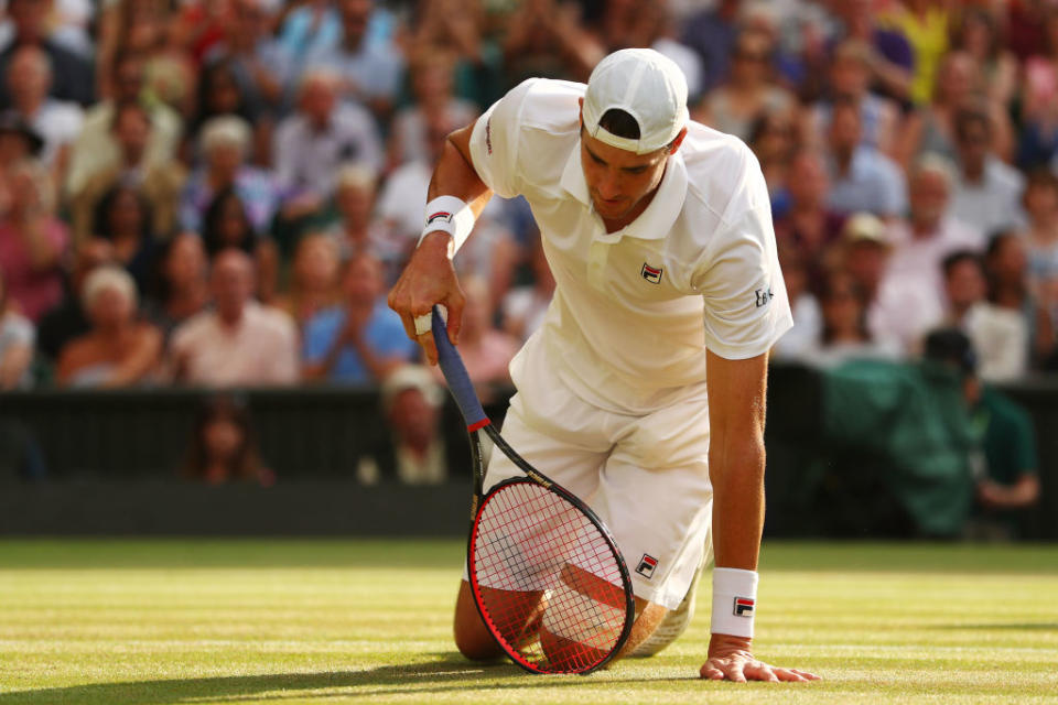 John Isner reacts after a point in his marathon semifinal match against Kevin Anderson at Wimbledon. (Getty Images)