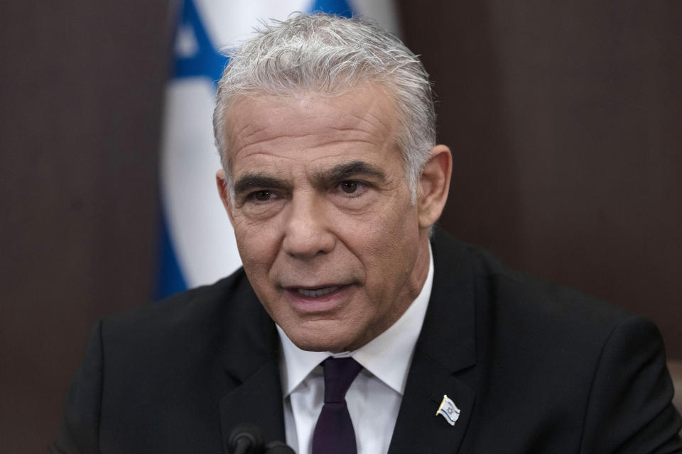 Israeli Prime Minister Yair Lapid speaks at the start of the the weekly cabinet meeting in Jerusalem, Sunday, July 10, 2022.(AP Photo/Maya Alleruzzo, Pool)