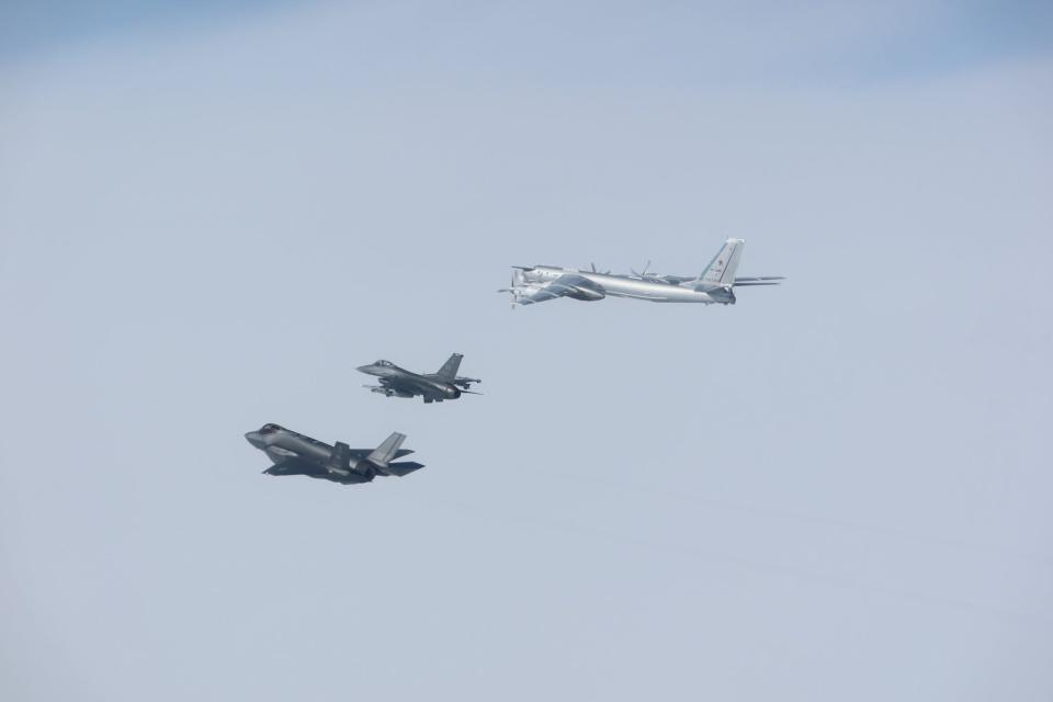 An F-16 (C) and F-35 (L) assigned to North American Aerospace Defense Command intercept a Russian TU-95 bomber aircraft near Alaska on July 24, 2024