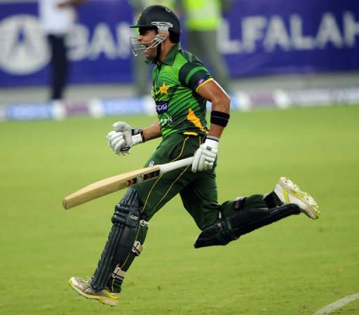 Pakistani batsman Umar Akmal celebrates after winning the second Twenty20 international cricket match against Australia. Pakistan beat Australia in a tense Super over finish