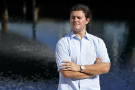 Freddy Vallejo Jr. poses for a photograph, Saturday, Sept. 26, 2020, at the family vacation home in Key Largo, in the Florida Keys. His grandfather Jorge Vallejo, a retired OB-GYN, and uncle Carlos Vallejo, who practiced internal medicine, died of the coronavirus within weeks of one another in South Florida. (AP Photo/Lynne Sladky)