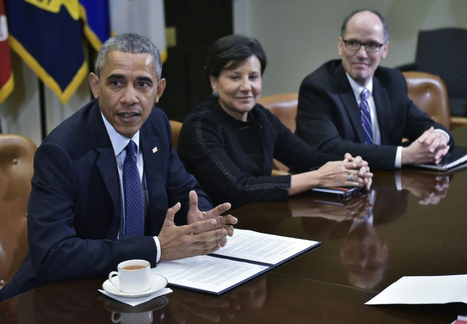 US President Barack Obama speaks following a meeting with his economic team in the Roosevelt Room of the White House on March 4, 2016 in Washington, DC.  From center is Commerce Secretary Penny Pritzker, and Labor Secretary Thomas Perez. / AFP / Mandel Ngan        (Photo credit should read MANDEL NGAN/AFP via Getty Images)