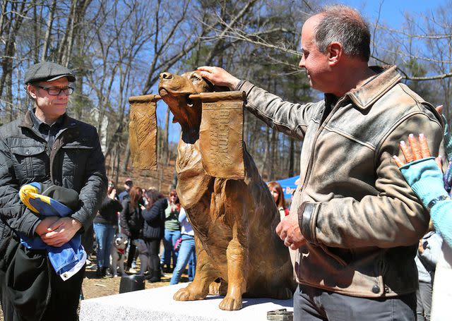 <p>John Tlumacki/The Boston Globe via Getty</p> The statue of Spencer, the official dog of the Boston Marathon, erected along the marathon's route in Massachusetts
