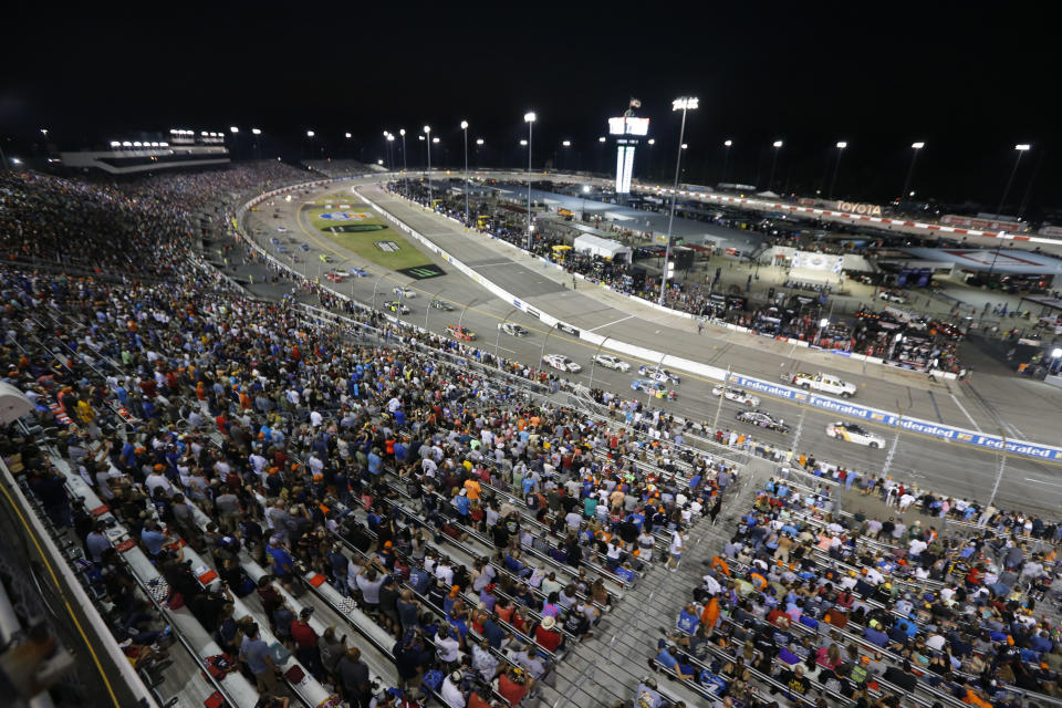 The field follows the pace car before the NASCAR Monster Energy Cup series auto race at Richmond Raceway in Richmond, Va., Saturday, Sept. 21, 2019. (AP Photo/Steve Helber)