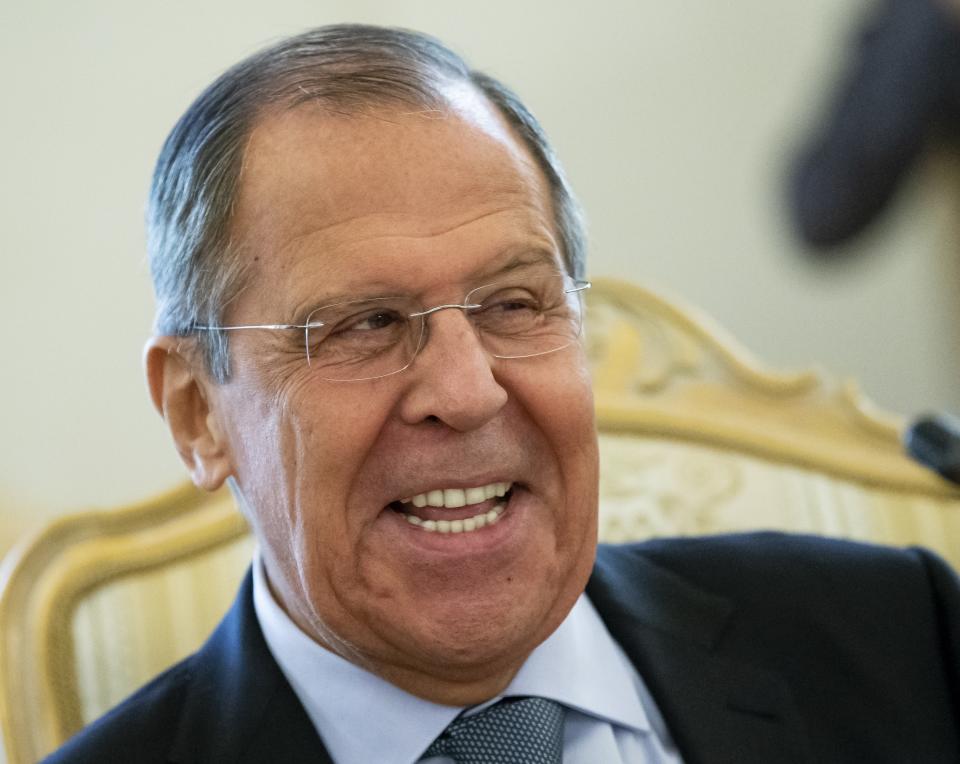 Russian Foreign Minister Sergey Lavrov smiles as he speaks to Madagascar's Foreign Minister Eloi Maxime Alphonse Dovo during their meeting in Moscow, Russia, Monday, Oct. 22, 2018. Lavrov will meet with U.S. National Security Adviser John Bolton for high-tension talks in Moscow, after President Donald Trump announced his intention to withdraw from a landmark nuclear weapons treaty. (AP Photo/Alexander Zemlianichenko)