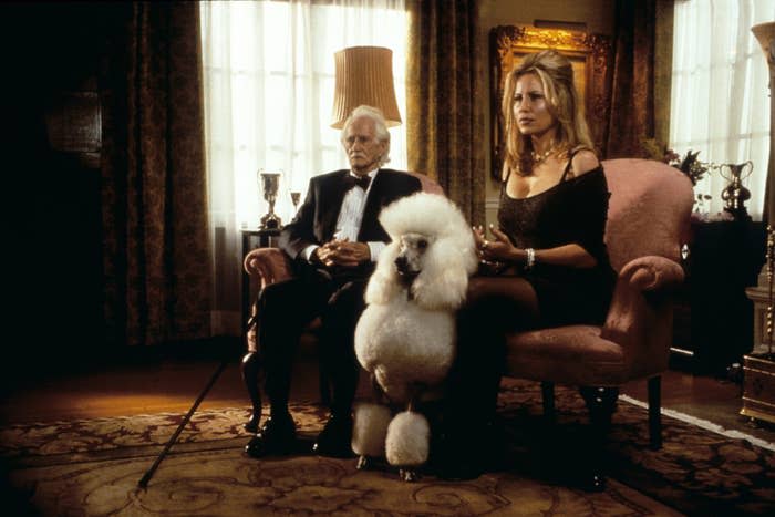 Patrick Cranshaw and Jennifer Coolidge sitting next to their dog.