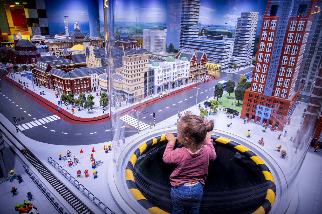 THE HAGUE, NETHERLANDS - JUNE 23: A child is seen looking at a Lego model of The Hague inner city during the opening of Legoland theme park at Scheveningen on June 23, 2021 in The Hague, Netherlands. (Photo by Patrick van Katwijk/BSR Agency/Getty Images)