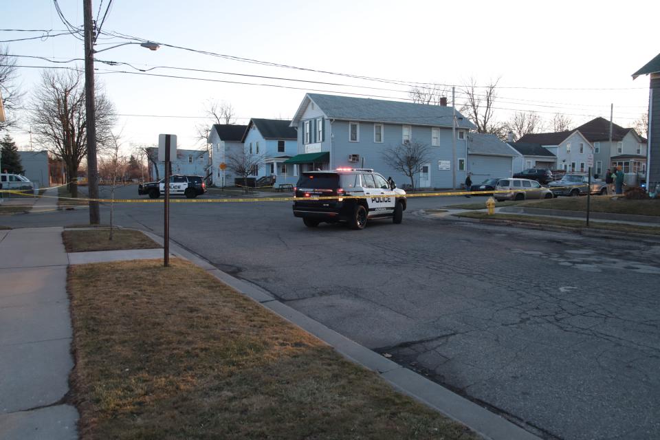 Police block off the intersection of Frank and Tecumseh streets in Adrian while investigating a fatal shooting Feb. 13. Witnesses described to police an exchange of gunfire between the occupants of two vehicles.