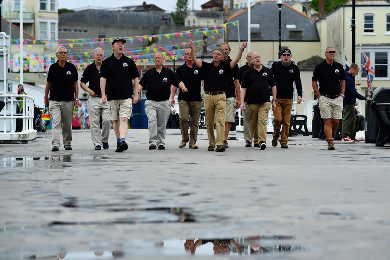 Sea Shanty singing group Bryher's Boys pose for a picture at Prince Wales Pier in Falmouth