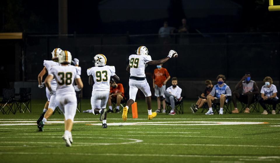 St. X defensive end Micah Carter (99) returned an interception for a touchdown to put the Tigers up 7-0 in the first half against the DeSales Colts. Friday, Oct. 9, 2020
