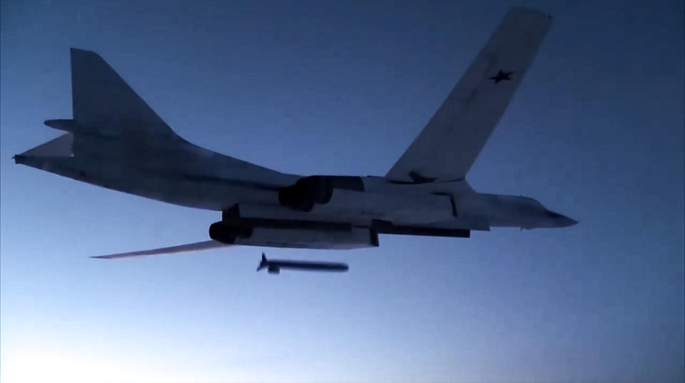 FILE - In this photo taken from a video distributed by Russian Defense Ministry Press Service, on Dec. 9, 2020, a Russian Tu-160 strategic bomber fires a cruise missile at test targets, during a military drills, Russia. The Russian Defense Ministry said that the military will hold drills involving tactical nuclear weapons – the first time such exercise was publicly announced by Moscow. (Russian Defense Ministry Press Service via AP, File)