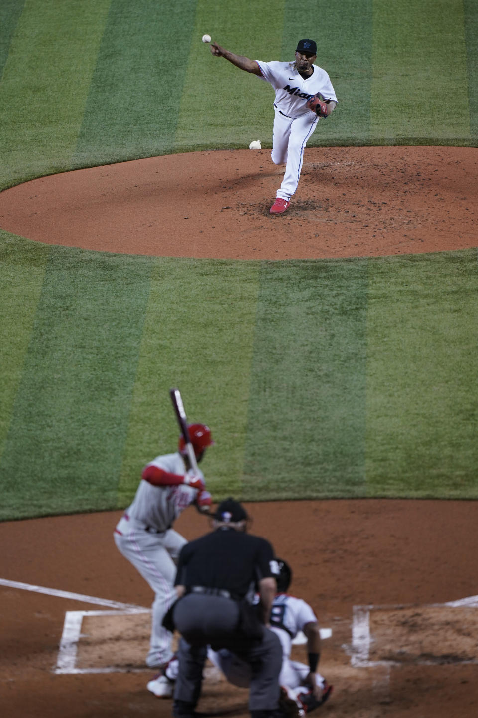 Miami Marlins' Sixto Sanchez, top, pitches to Philadelphia Phillies' Andrew McCutchen during the third inning of the first game of a baseball doubleheader, Sunday, Sept. 13, 2020, in Miami. (AP Photo/Wilfredo Lee)