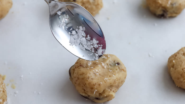 cookie dough being sprinkled with salt