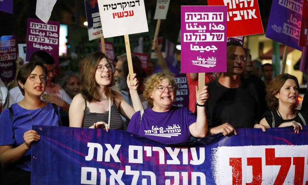 Demonstrators attend a rally in Tel Aviv to protest against the “nation-state” basic law.