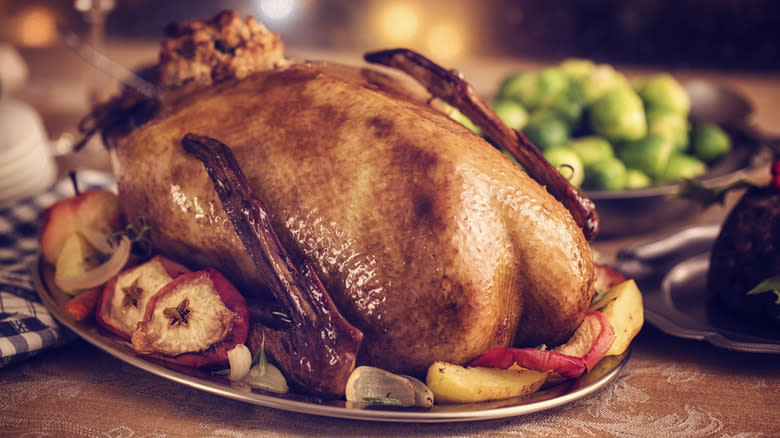 Roasted goose with accompaniments on platter