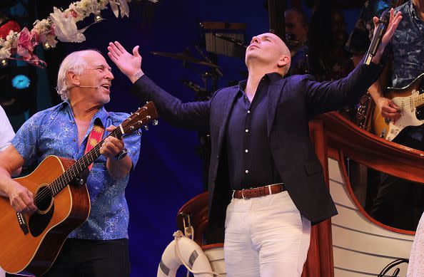 NEW YORK, NY - JUNE 15: Jimmy Buffett and Pitbull onstage as Pitbull makes his broadway debut guest starring in the hit Jimmy Buffett Musical 