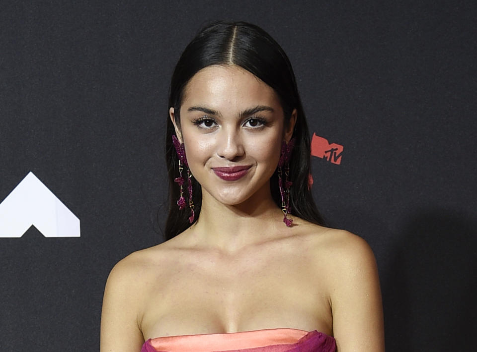 FILE - Olivia Rodrigo arrives at the MTV Video Music Awards on Sept. 12, 2021, in New York. The Disney actress and singer-songwriter broke out with hits from her 2021 debut record “Sour,” which led to seven nominations at the AMAs, including artist of the year and new artist of the year. The nominations were announced Thursday for the fan-voted awards show that will air from Los Angeles on ABC on Nov. 21. (Photo by Evan Agostini/Invision/AP, File)